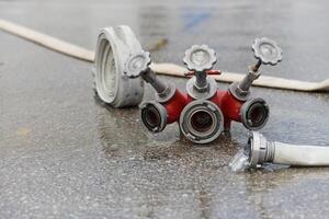 Coiled Fire Hose Ready for Action on the Ground photo