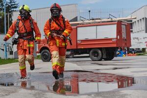 Firefighter Team Training with Various Tools in Professional Gear photo