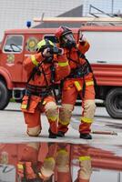 Firefighter Team Learning Thermal Camera Usage During Training Session photo