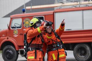 Firefighter Team Learning Thermal Camera Usage During Training Session photo
