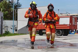 A team of confident and accomplished firefighters strides purposefully in their uniforms, exuding pride and satisfaction after successfully completing a challenging firefighting mission photo