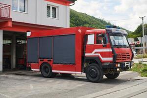 A state-of-the-art firetruck, equipped with advanced rescue technology, stands ready with its skilled firefighting team, prepared to intervene and respond rapidly to emergencies, ensuring the safety photo
