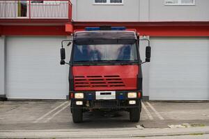 A state-of-the-art firetruck, equipped with advanced rescue technology, stands ready with its skilled firefighting team, prepared to intervene and respond rapidly to emergencies, ensuring the safety photo