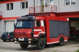 A state-of-the-art firetruck, equipped with advanced rescue technology, stands ready with its skilled firefighting team, prepared to intervene and respond rapidly to emergencies, ensuring the safety photo
