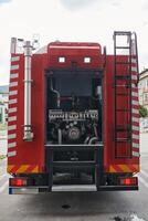A state-of-the-art firetruck, equipped with advanced rescue technology, stands ready with its skilled firefighting team, prepared to intervene and respond rapidly to emergencies, ensuring the safety photo