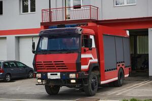A state-of-the-art firetruck, equipped with advanced rescue technology, stands ready with its skilled firefighting team, prepared to intervene and respond rapidly to emergencies, ensuring the safety photo