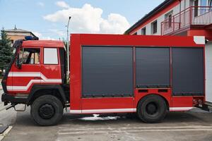 A state-of-the-art firetruck, equipped with advanced rescue technology, stands ready with its skilled firefighting team, prepared to intervene and respond rapidly to emergencies, ensuring the safety photo