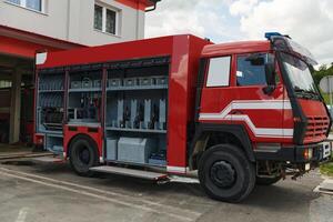 A state-of-the-art firetruck, equipped with advanced rescue technology, stands ready with its skilled firefighting team, prepared to intervene and respond rapidly to emergencies, ensuring the safety photo