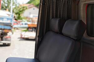 The close-up capture reveals the intricate details of the ergonomic seats and high-tech interior of a modern firefighting truck, showcasing a perfect blend of functionality and safety features photo