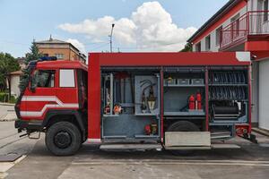 A state-of-the-art firetruck, equipped with advanced rescue technology, stands ready with its skilled firefighting team, prepared to intervene and respond rapidly to emergencies, ensuring the safety photo