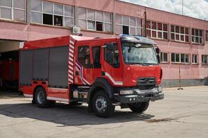 A state-of-the-art firetruck, equipped with advanced rescue technology, stands ready with its skilled firefighting team, prepared to intervene and respond rapidly to emergencies, ensuring the safety photo