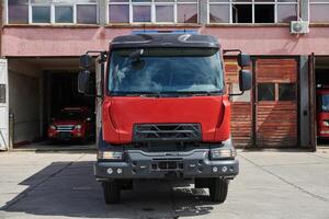 A state-of-the-art firetruck, equipped with advanced rescue technology, stands ready with its skilled firefighting team, prepared to intervene and respond rapidly to emergencies, ensuring the safety photo