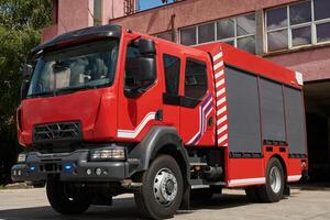 A state-of-the-art firetruck, equipped with advanced rescue technology, stands ready with its skilled firefighting team, prepared to intervene and respond rapidly to emergencies, ensuring the safety photo