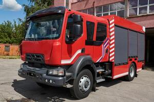 A state-of-the-art firetruck, equipped with advanced rescue technology, stands ready with its skilled firefighting team, prepared to intervene and respond rapidly to emergencies, ensuring the safety photo