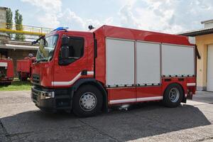 A state-of-the-art firetruck, equipped with advanced rescue technology, stands ready with its skilled firefighting team, prepared to intervene and respond rapidly to emergencies, ensuring the safety photo