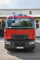 A state-of-the-art firetruck, equipped with advanced rescue technology, stands ready with its skilled firefighting team, prepared to intervene and respond rapidly to emergencies, ensuring the safety photo