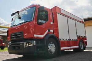 A state-of-the-art firetruck, equipped with advanced rescue technology, stands ready with its skilled firefighting team, prepared to intervene and respond rapidly to emergencies, ensuring the safety photo