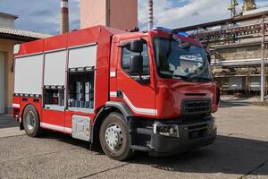 A state-of-the-art firetruck, equipped with advanced rescue technology, stands ready with its skilled firefighting team, prepared to intervene and respond rapidly to emergencies, ensuring the safety photo