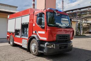 A state-of-the-art firetruck, equipped with advanced rescue technology, stands ready with its skilled firefighting team, prepared to intervene and respond rapidly to emergencies, ensuring the safety photo