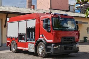 A state-of-the-art firetruck, equipped with advanced rescue technology, stands ready with its skilled firefighting team, prepared to intervene and respond rapidly to emergencies, ensuring the safety photo