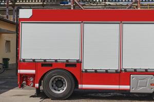 A state-of-the-art firetruck, equipped with advanced rescue technology, stands ready with its skilled firefighting team, prepared to intervene and respond rapidly to emergencies, ensuring the safety photo