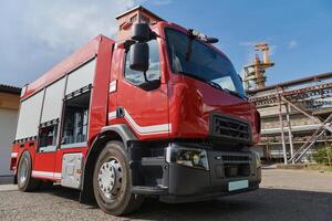 A state-of-the-art firetruck, equipped with advanced rescue technology, stands ready with its skilled firefighting team, prepared to intervene and respond rapidly to emergencies, ensuring the safety photo