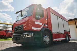 A state-of-the-art firetruck, equipped with advanced rescue technology, stands ready with its skilled firefighting team, prepared to intervene and respond rapidly to emergencies, ensuring the safety photo