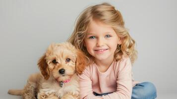 cute blonde girl with a small puppy photo