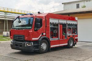 A state-of-the-art firetruck, equipped with advanced rescue technology, stands ready with its skilled firefighting team, prepared to intervene and respond rapidly to emergencies, ensuring the safety photo