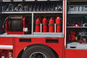 A state-of-the-art firetruck, equipped with advanced rescue technology, stands ready with its skilled firefighting team, prepared to intervene and respond rapidly to emergencies, ensuring the safety photo
