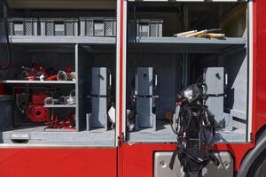 A state-of-the-art firetruck, equipped with advanced rescue technology, stands ready with its skilled firefighting team, prepared to intervene and respond rapidly to emergencies, ensuring the safety photo