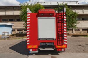 A state-of-the-art firetruck, equipped with advanced rescue technology, stands ready with its skilled firefighting team, prepared to intervene and respond rapidly to emergencies, ensuring the safety photo