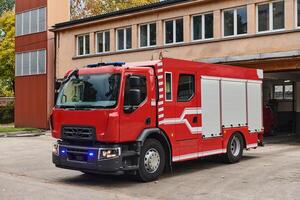A state-of-the-art firetruck, equipped with advanced rescue technology, stands ready with its skilled firefighting team, prepared to intervene and respond rapidly to emergencies, ensuring the safety photo