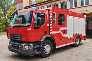 A state-of-the-art firetruck, equipped with advanced rescue technology, stands ready with its skilled firefighting team, prepared to intervene and respond rapidly to emergencies, ensuring the safety photo