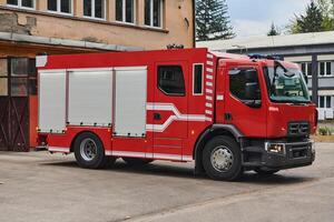 A state-of-the-art firetruck, equipped with advanced rescue technology, stands ready with its skilled firefighting team, prepared to intervene and respond rapidly to emergencies, ensuring the safety photo