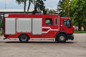 A state-of-the-art firetruck, equipped with advanced rescue technology, stands ready with its skilled firefighting team, prepared to intervene and respond rapidly to emergencies, ensuring the safety photo