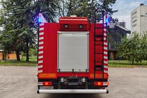 A state-of-the-art firetruck, equipped with advanced rescue technology, stands ready with its skilled firefighting team, prepared to intervene and respond rapidly to emergencies, ensuring the safety photo
