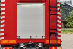 A state-of-the-art firetruck, equipped with advanced rescue technology, stands ready with its skilled firefighting team, prepared to intervene and respond rapidly to emergencies, ensuring the safety photo