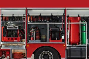 A state-of-the-art firetruck, equipped with advanced rescue technology, stands ready with its skilled firefighting team, prepared to intervene and respond rapidly to emergencies, ensuring the safety photo