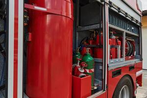 A state-of-the-art firetruck, equipped with advanced rescue technology, stands ready with its skilled firefighting team, prepared to intervene and respond rapidly to emergencies, ensuring the safety photo