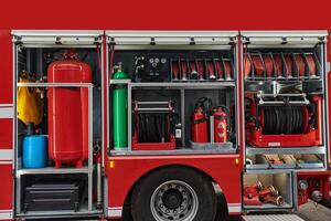 A state-of-the-art firetruck, equipped with advanced rescue technology, stands ready with its skilled firefighting team, prepared to intervene and respond rapidly to emergencies, ensuring the safety photo