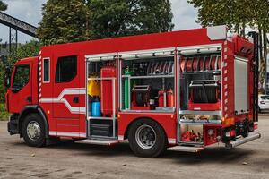 A state-of-the-art firetruck, equipped with advanced rescue technology, stands ready with its skilled firefighting team, prepared to intervene and respond rapidly to emergencies, ensuring the safety photo