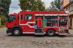 A state-of-the-art firetruck, equipped with advanced rescue technology, stands ready with its skilled firefighting team, prepared to intervene and respond rapidly to emergencies, ensuring the safety photo