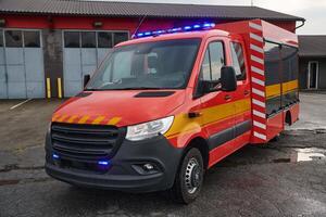 A state-of-the-art firetruck, equipped with advanced rescue technology, stands ready with its skilled firefighting team, prepared to intervene and respond rapidly to emergencies, ensuring the safety photo