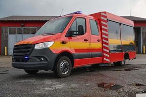 A state-of-the-art firetruck, equipped with advanced rescue technology, stands ready with its skilled firefighting team, prepared to intervene and respond rapidly to emergencies, ensuring the safety photo