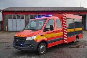 A state-of-the-art firetruck, equipped with advanced rescue technology, stands ready with its skilled firefighting team, prepared to intervene and respond rapidly to emergencies, ensuring the safety photo