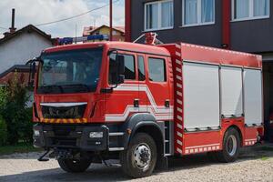 A state-of-the-art firetruck, equipped with advanced rescue technology, stands ready with its skilled firefighting team, prepared to intervene and respond rapidly to emergencies, ensuring the safety photo