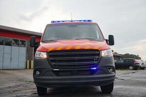A state-of-the-art firetruck, equipped with advanced rescue technology, stands ready with its skilled firefighting team, prepared to intervene and respond rapidly to emergencies, ensuring the safety photo