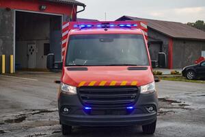 A state-of-the-art firetruck, equipped with advanced rescue technology, stands ready with its skilled firefighting team, prepared to intervene and respond rapidly to emergencies, ensuring the safety photo