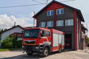 A state-of-the-art firetruck, equipped with advanced rescue technology, stands ready with its skilled firefighting team, prepared to intervene and respond rapidly to emergencies, ensuring the safety photo